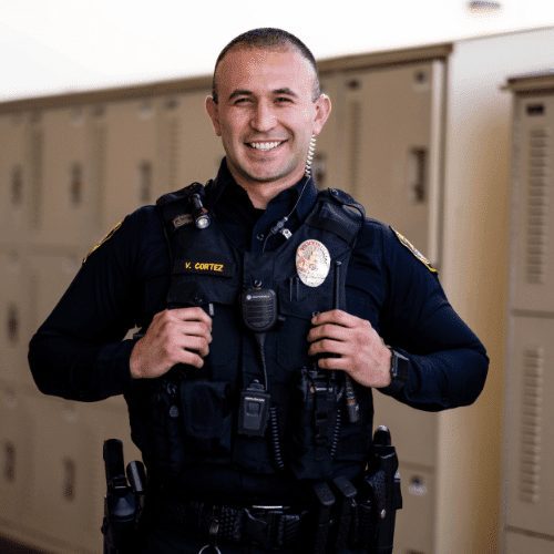 Santa Maria Police Officer Victor Cortez poses for a photo in front of the station's equipment lockers